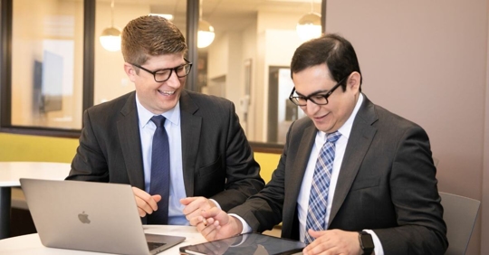 Two attorneys working at their desk