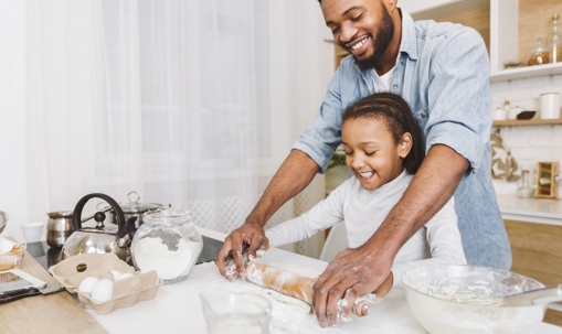 Dad and daughter baking around the holidays