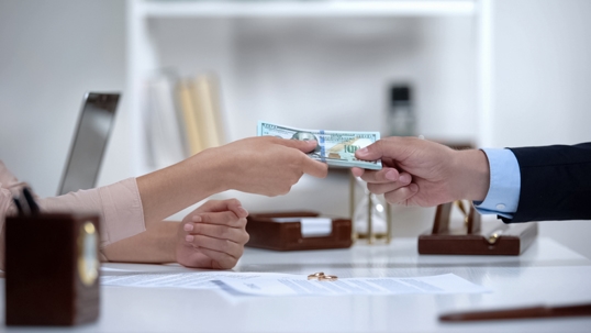 money exchanging between a man and a woman