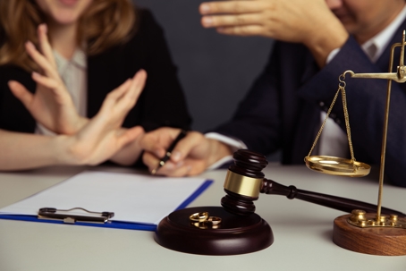 couple arguing in a lawyer's office