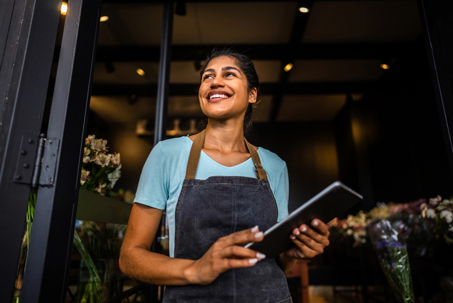 happy business owner opening her shop